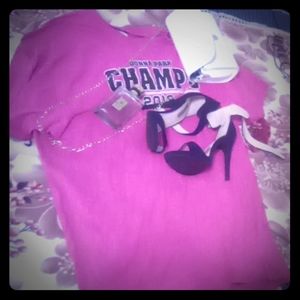 A pink dress and a white bag and black long heels